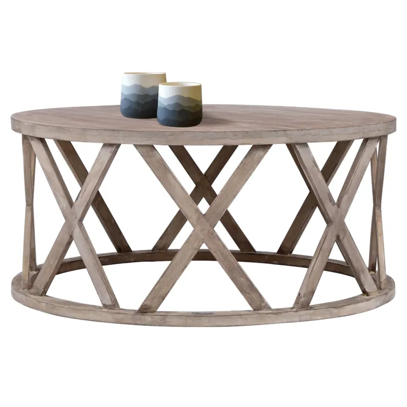 Runder Tisch aus Holz mit zwei Tassen auf der Oberfläche.